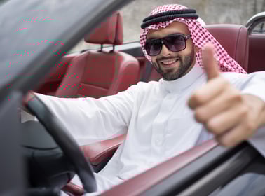 Arabic young businessman driving car