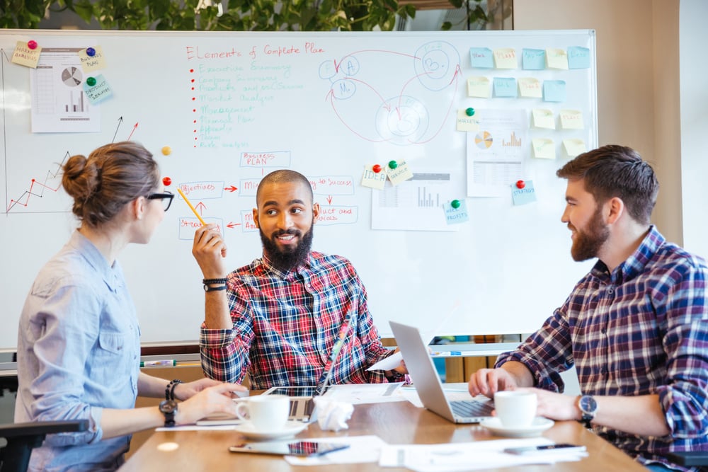 Multiethnic group of young people sitting in conference room and brainstorming on business meeting Multiethnic group of young people sitting in conference room and brainstorming on business meeting