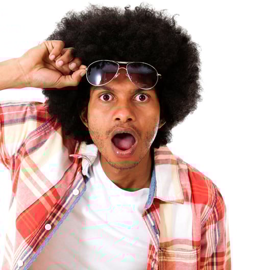 Surprised black man taking a good look - isolated over a white background